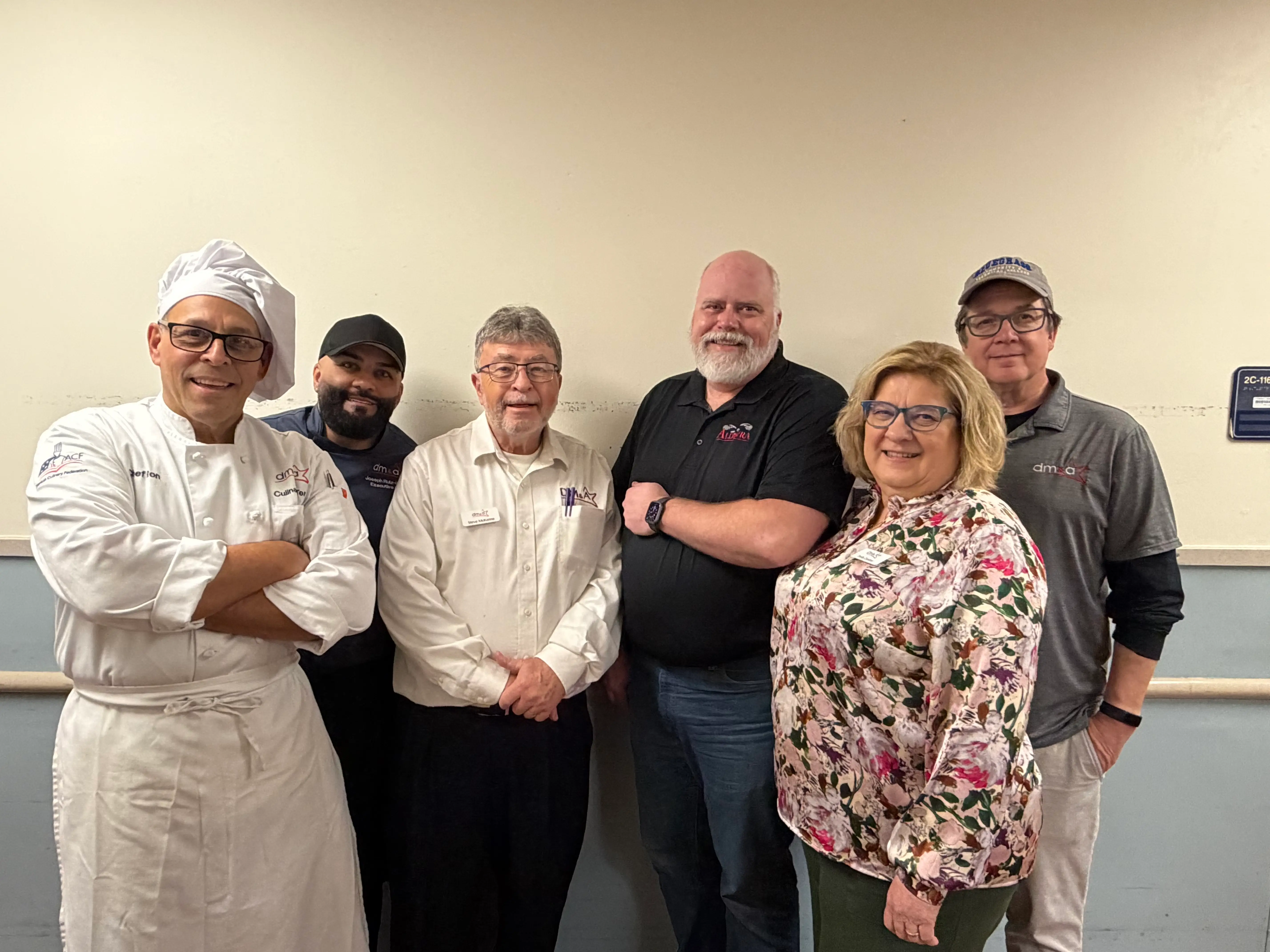 VA kitchen and project team group photo.