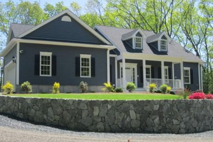 Gray house with a gable roof.
