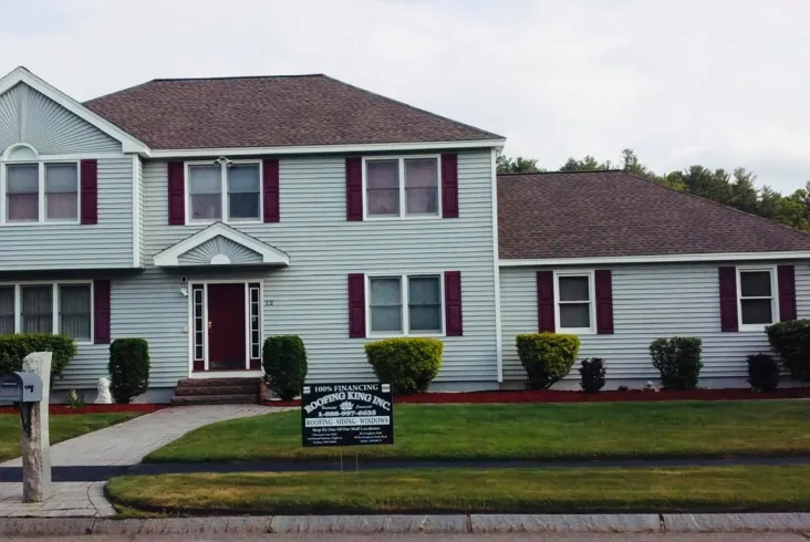 Large home with a balcony and expansive backyard.