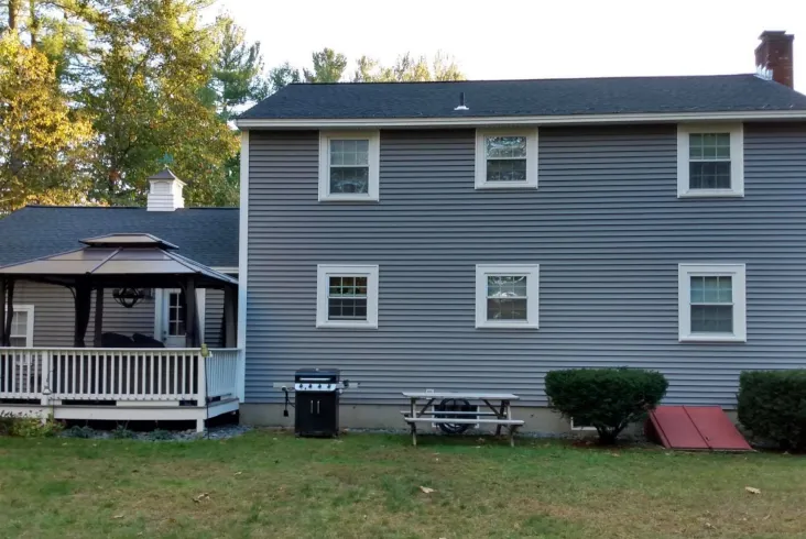 Traditional house with a gazebo in the backyard.