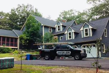 Large house with a Roofing King truck in Leominster, MA.