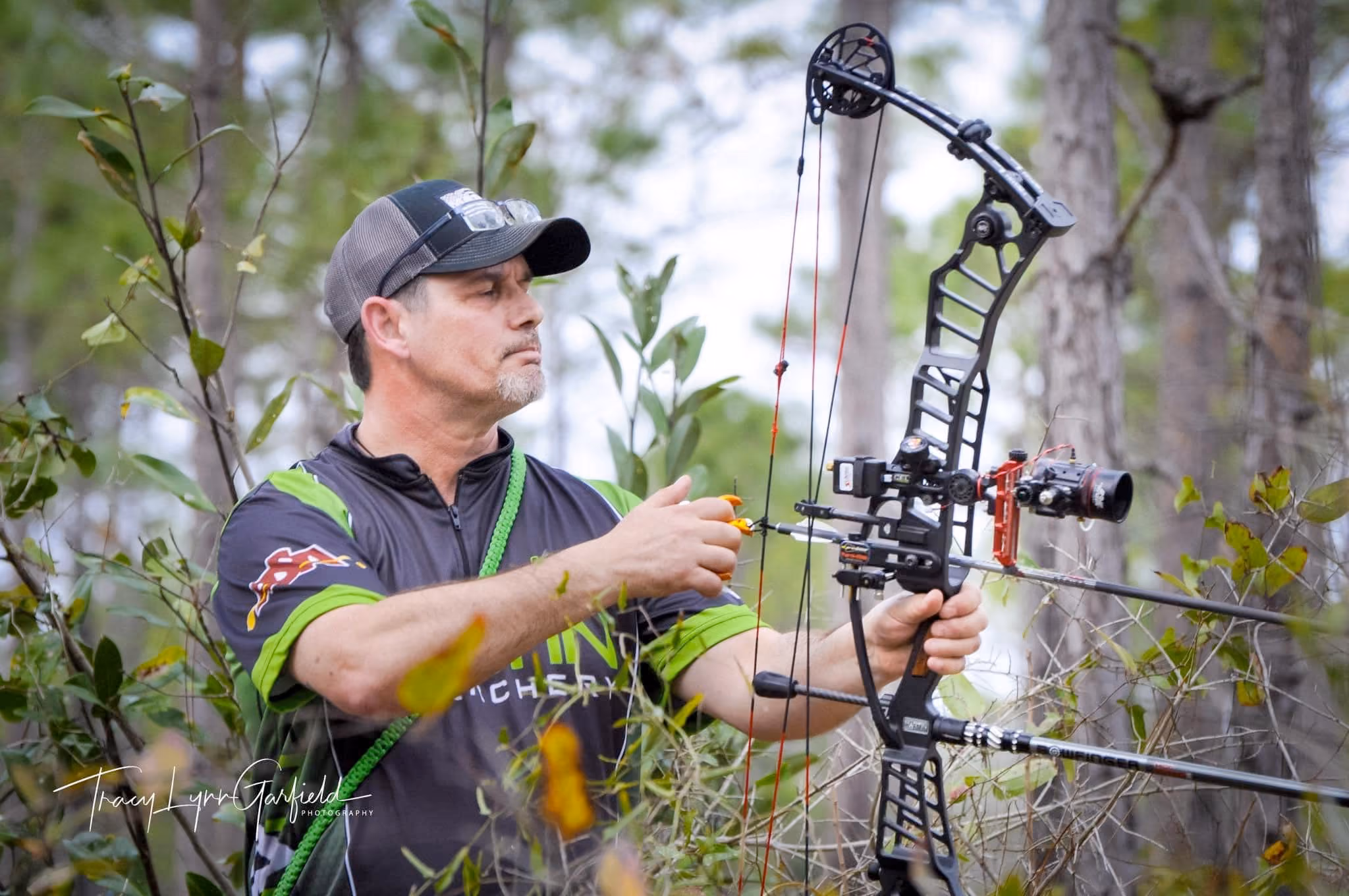 Archer shooting the Martin FireCat M3 compound bow outdoors
