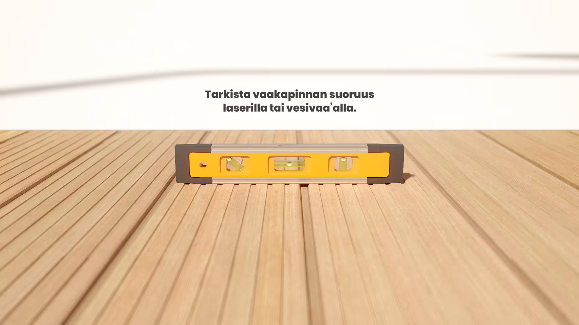 Keltainen vesivaaka asetettuna puupinnan päälle vaakasuoruuden tarkistamiseksi.