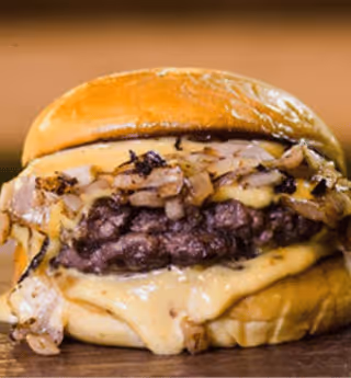 double cheeseburger loaded with melted cheese and caramelized onions
