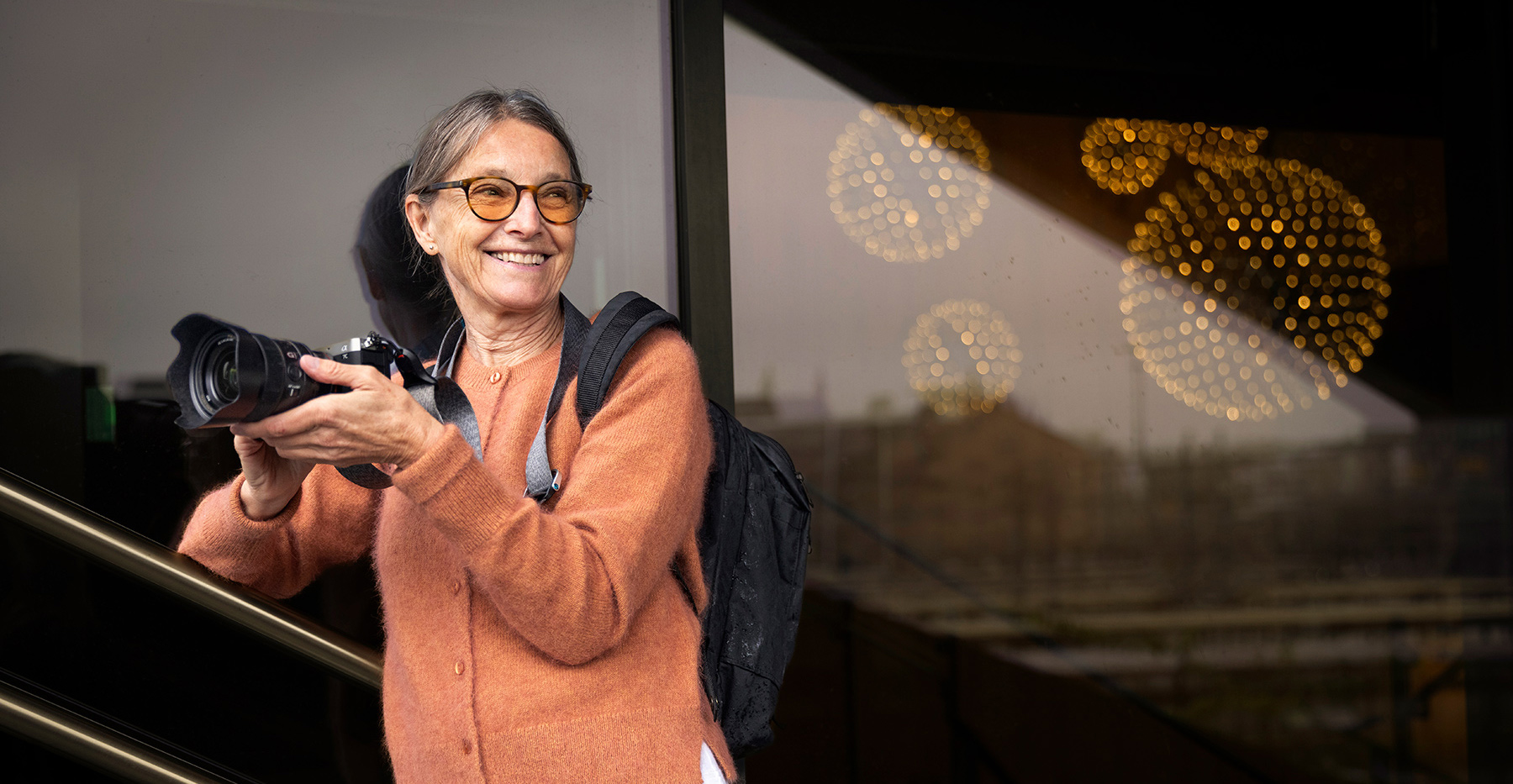 Woman feeling happy while using a mobile phone
