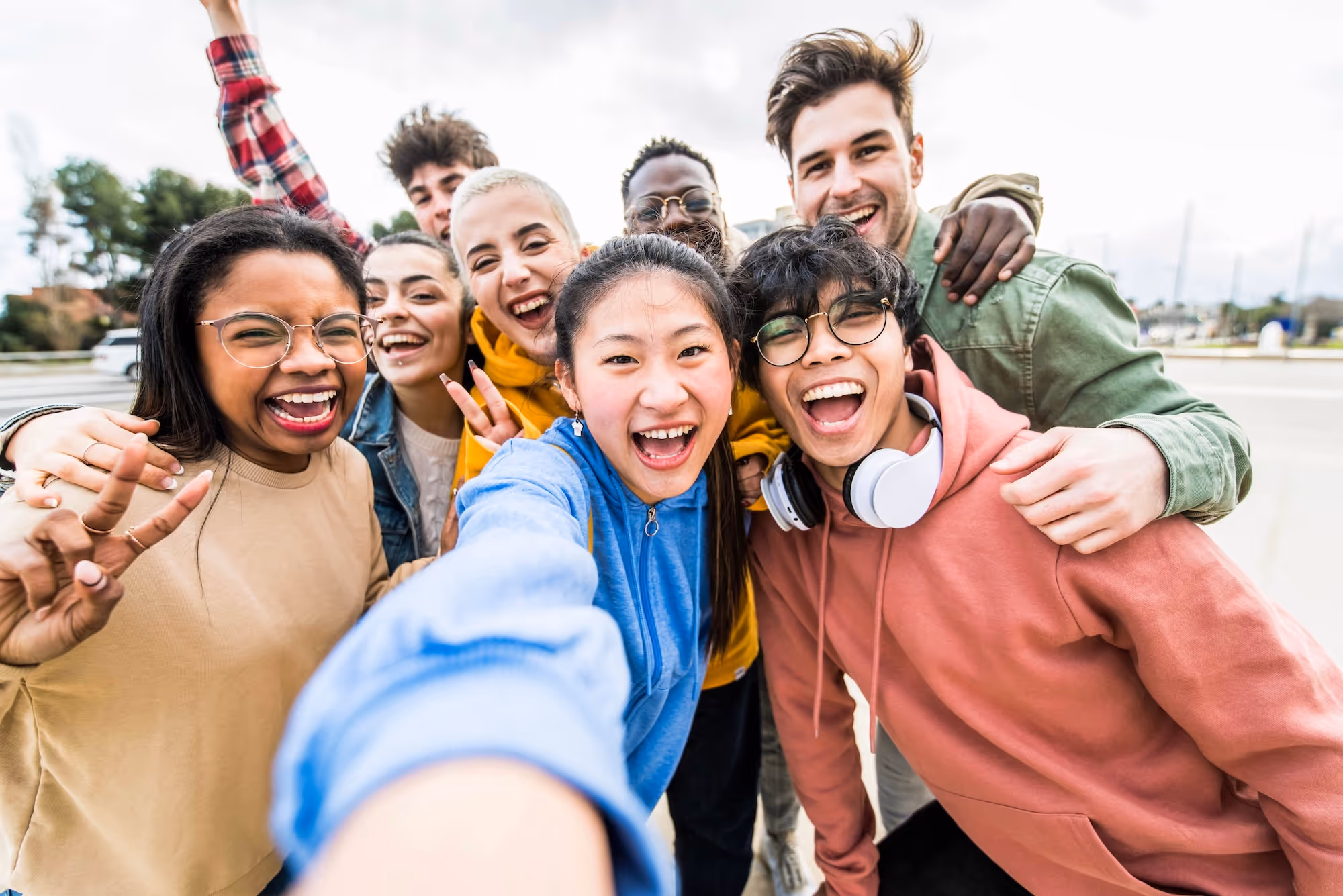 happy young adults taking a selfie