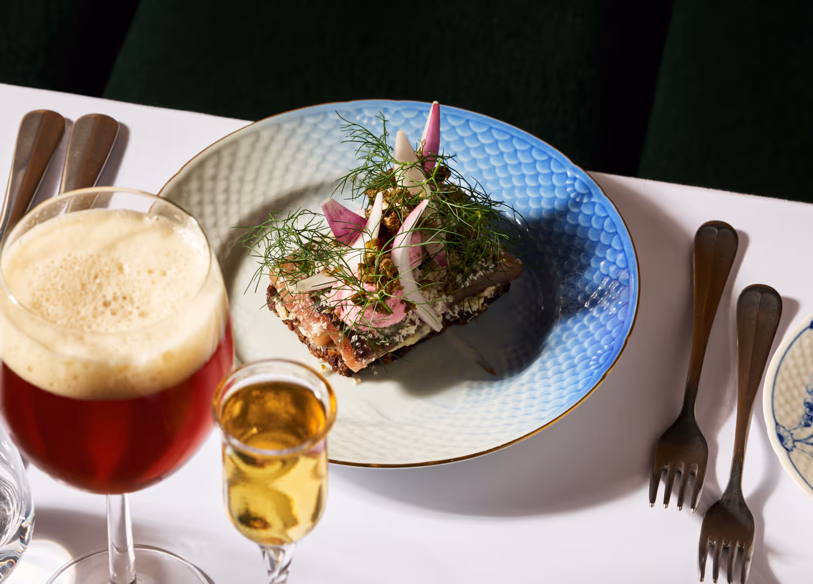 Traditional matured herring with onions and capers served with local beer and aquavit
