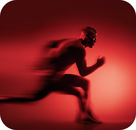 Side profile of a man running fast with motion blur effect on a red background.