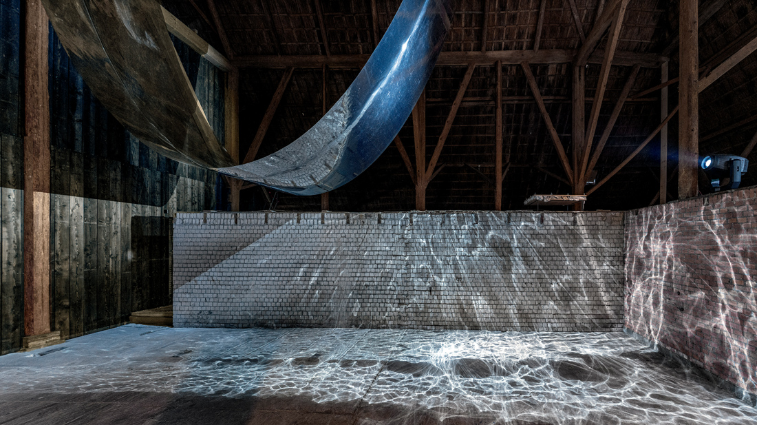 <em>Aesthetics of Decay</em>, 2025<br/> Motors, reflective foil, fan, LED Fresnel lights<br/>2000 × 225 × 1200 cm, 12 minutes