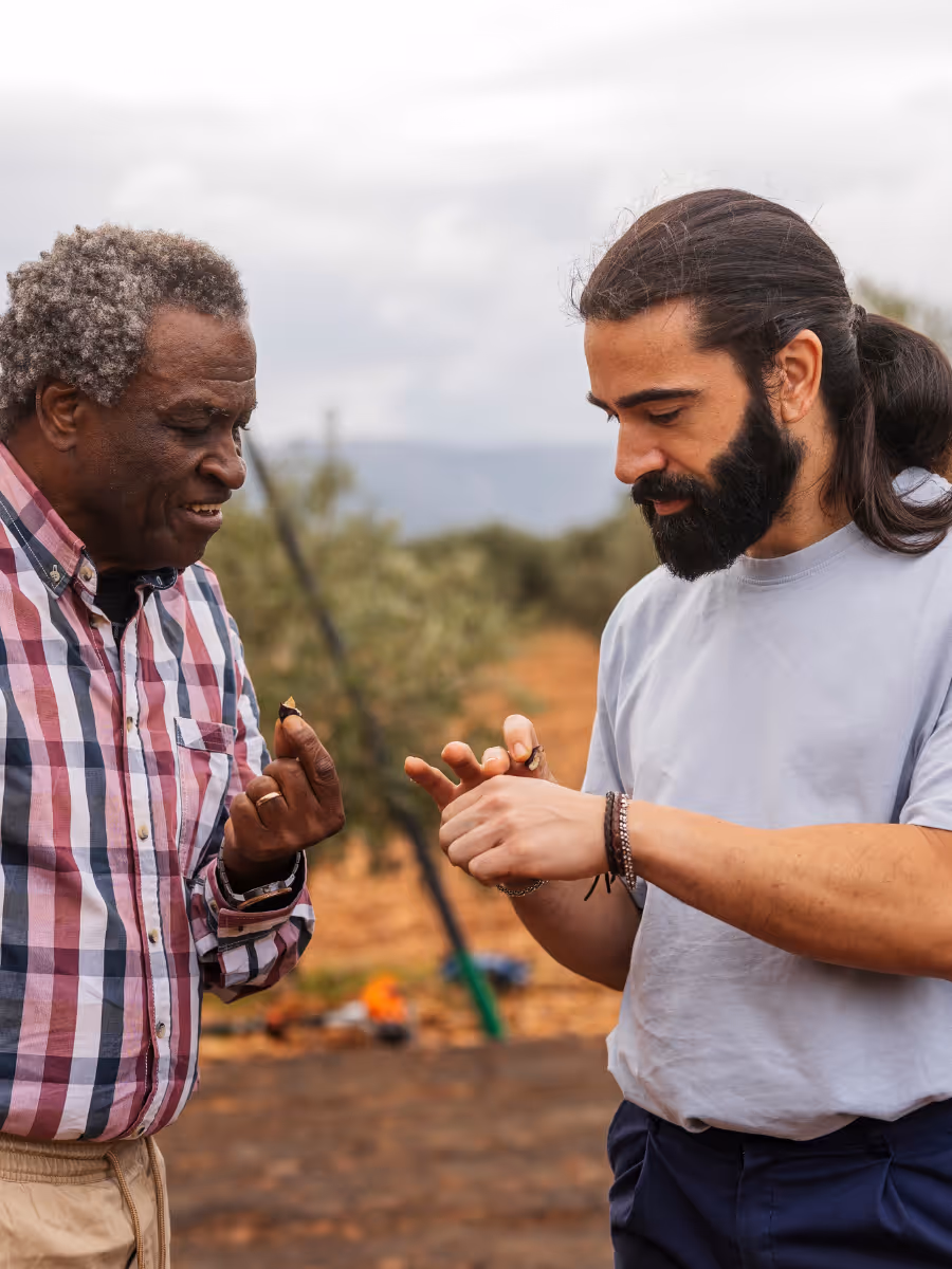 two men examining goods