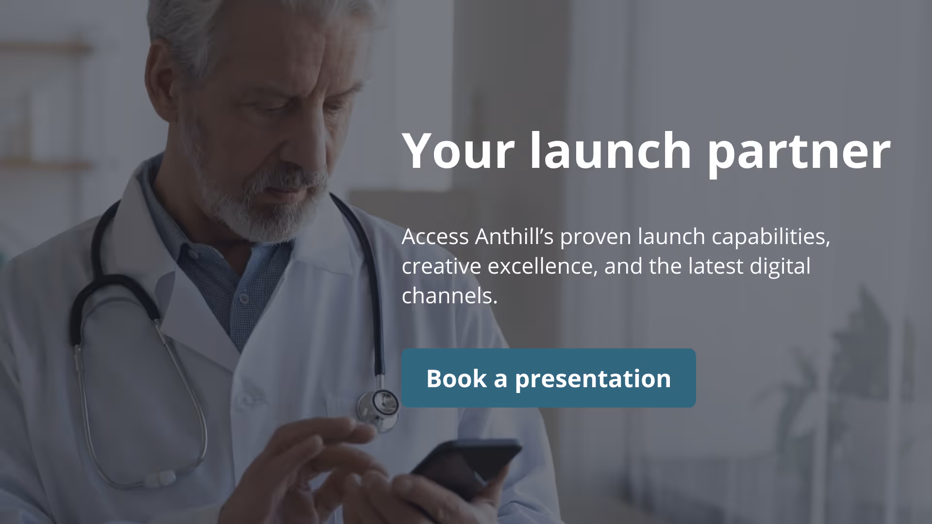 Older male doctor reviewing information from a pharmaceutical company on an iPhone
