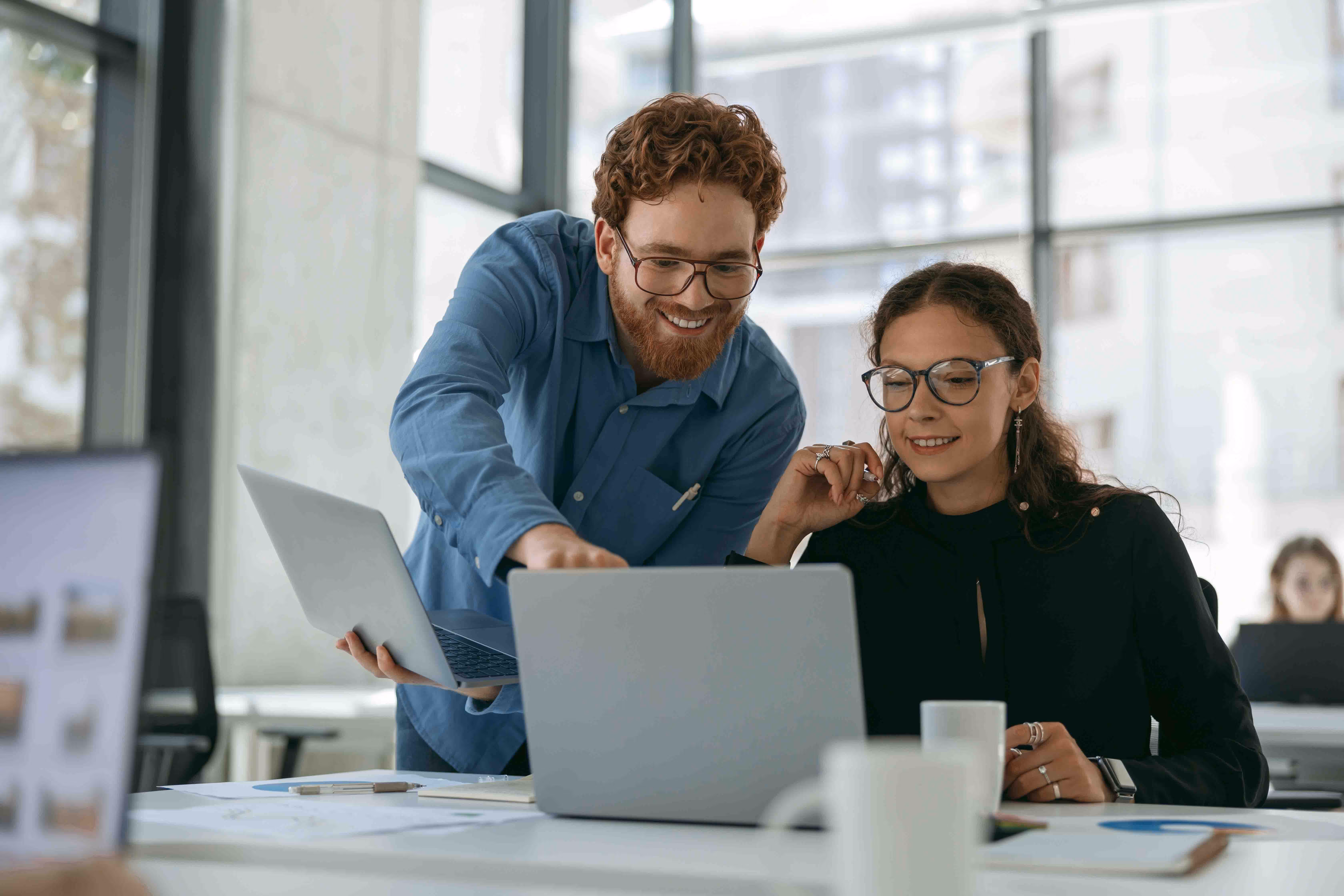 People in an office getting trained on a content authoring pharma solution