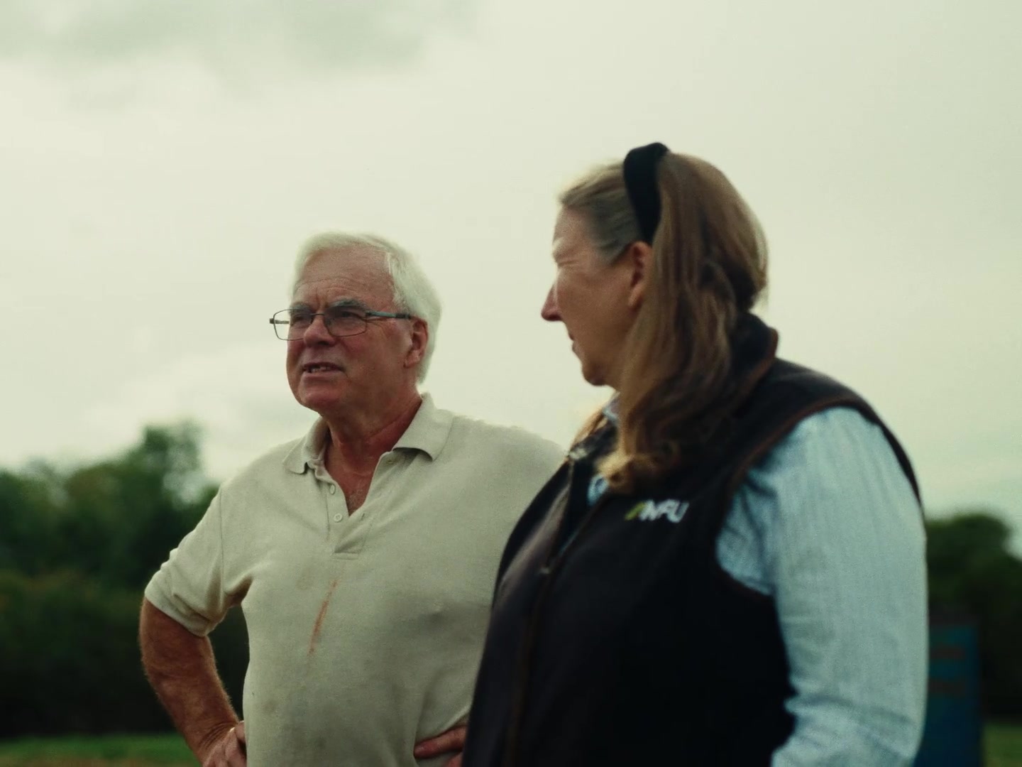 Farmer in conversation with NFU representative in the field