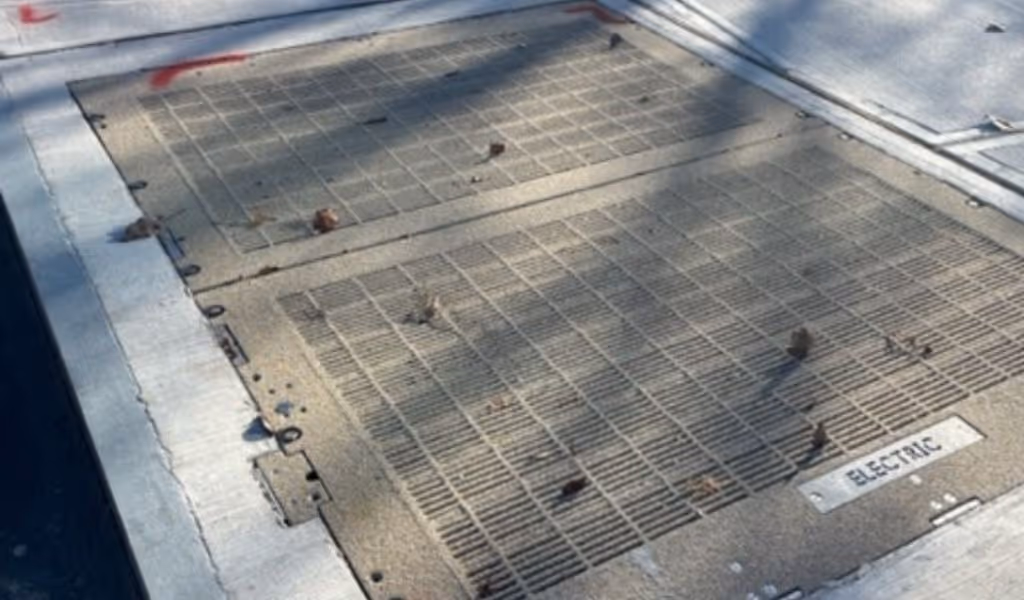 Rockzinq_Close-up view of textured epoxy aggregate coating on galvanized utility access hatch cover