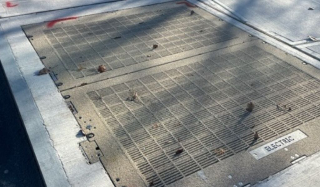 Rockzinq_Close-up view of textured epoxy aggregate coating on galvanized utility access hatch cover