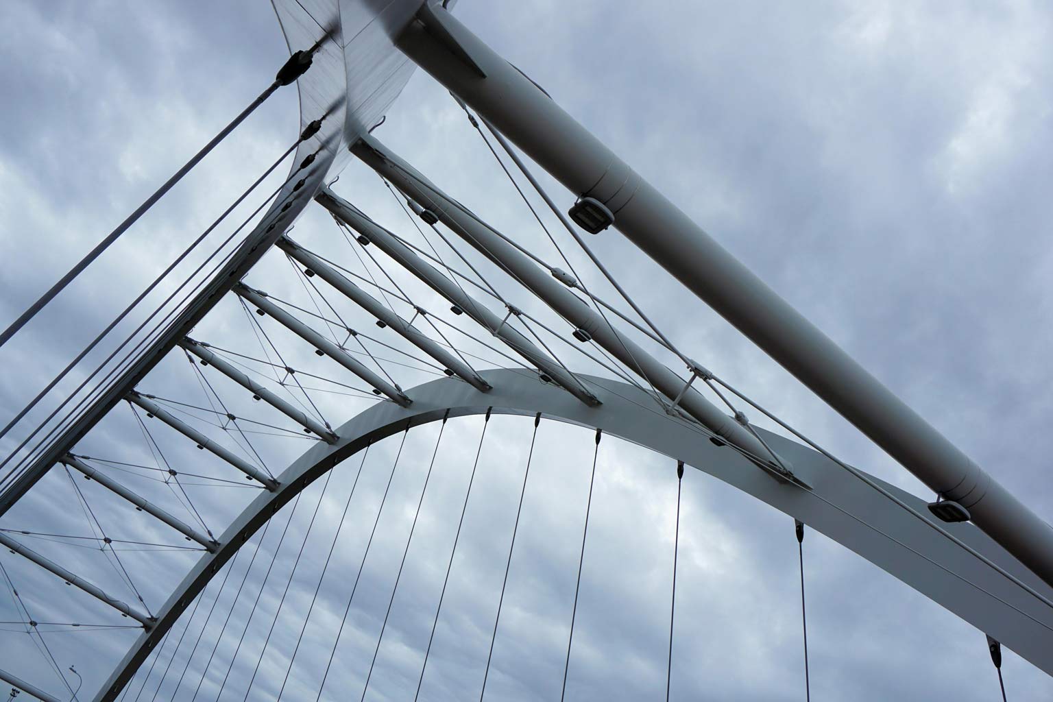 ASTM A123-24: Key Changes to the Hot-Dip Galvanizing Specification, showing hot-dip galvanizing and galvanized steel applications on a bridge.