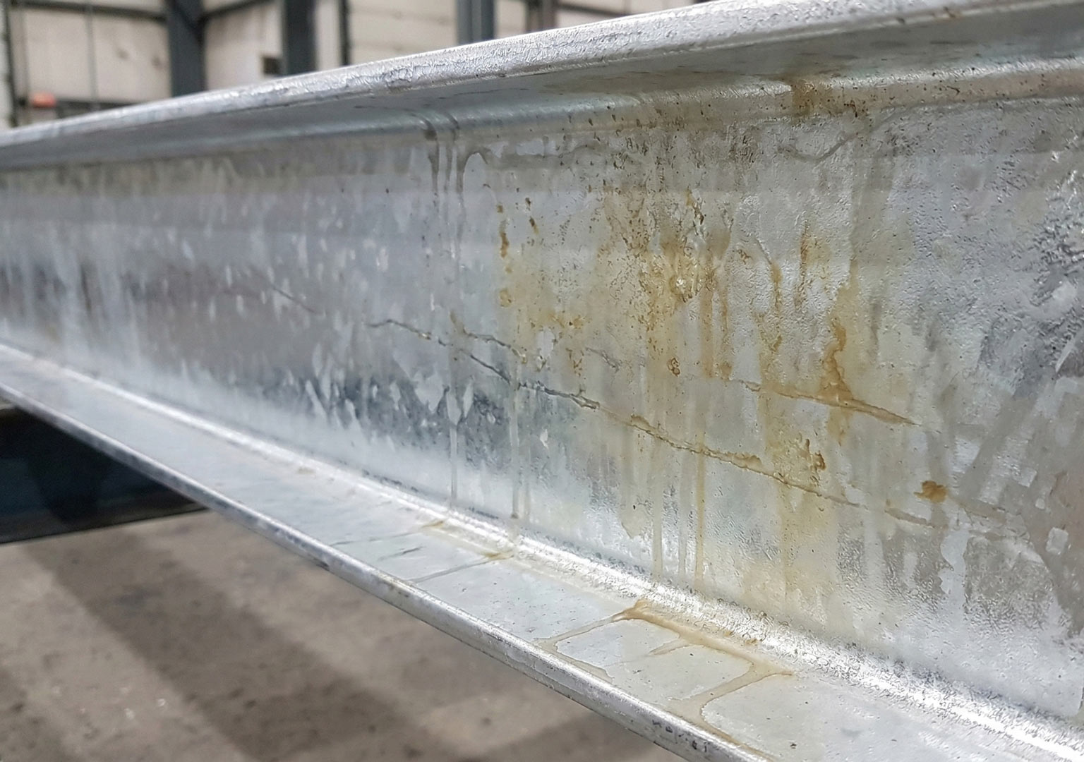 Hot dip galvanized steel surface showing light surface discoloration after quenching