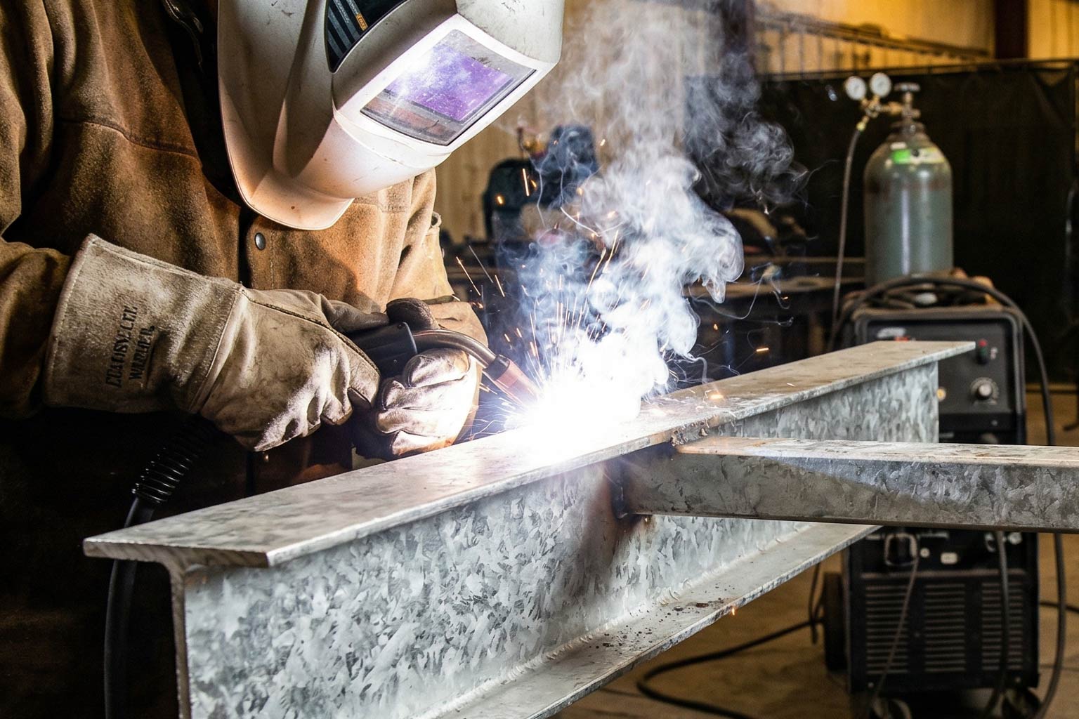 Welding operation on galvanized steel component near stainless steel assembly