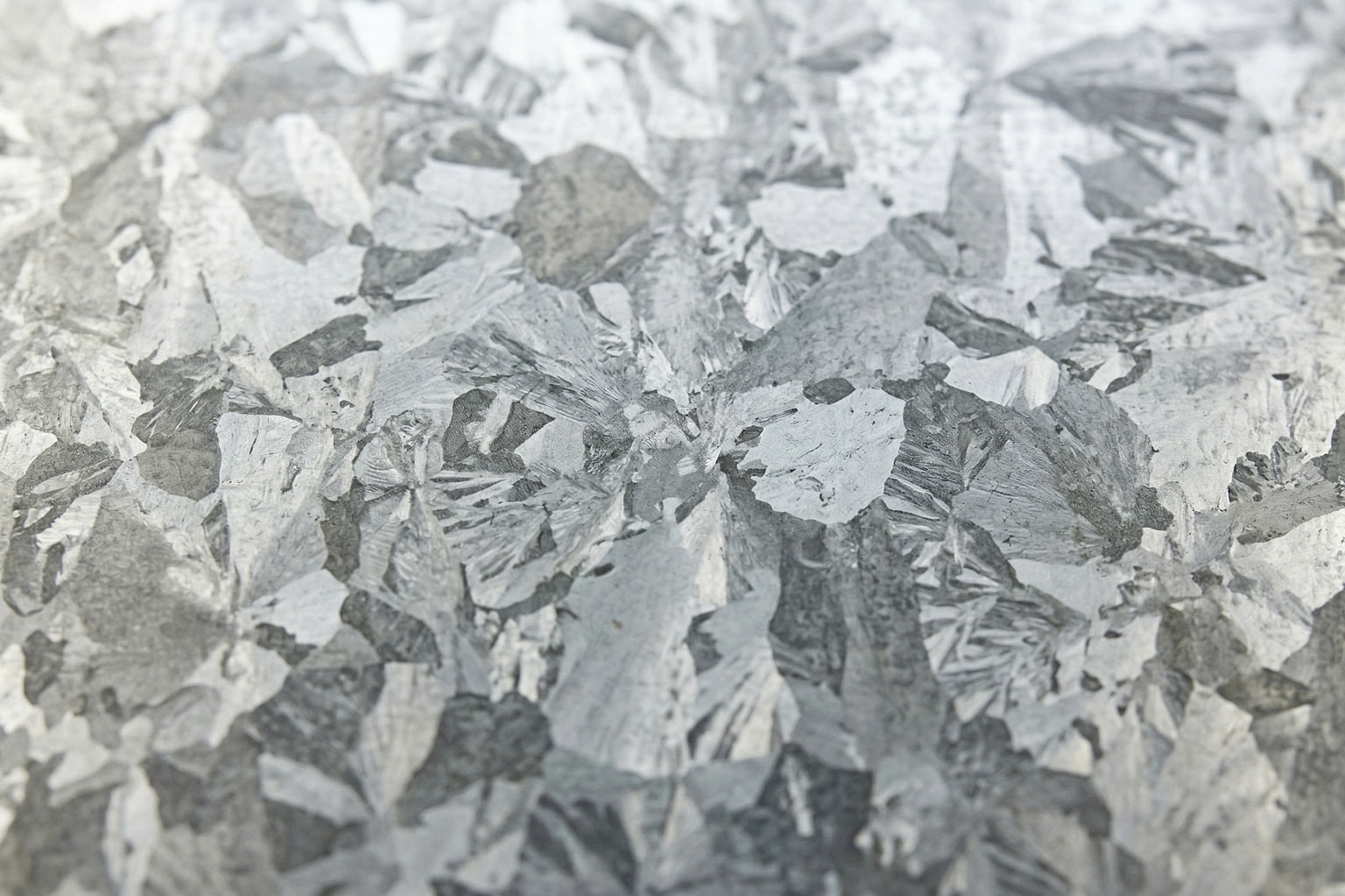 Close up of hot dip galvanized steel surface showing characteristic zinc coating texture