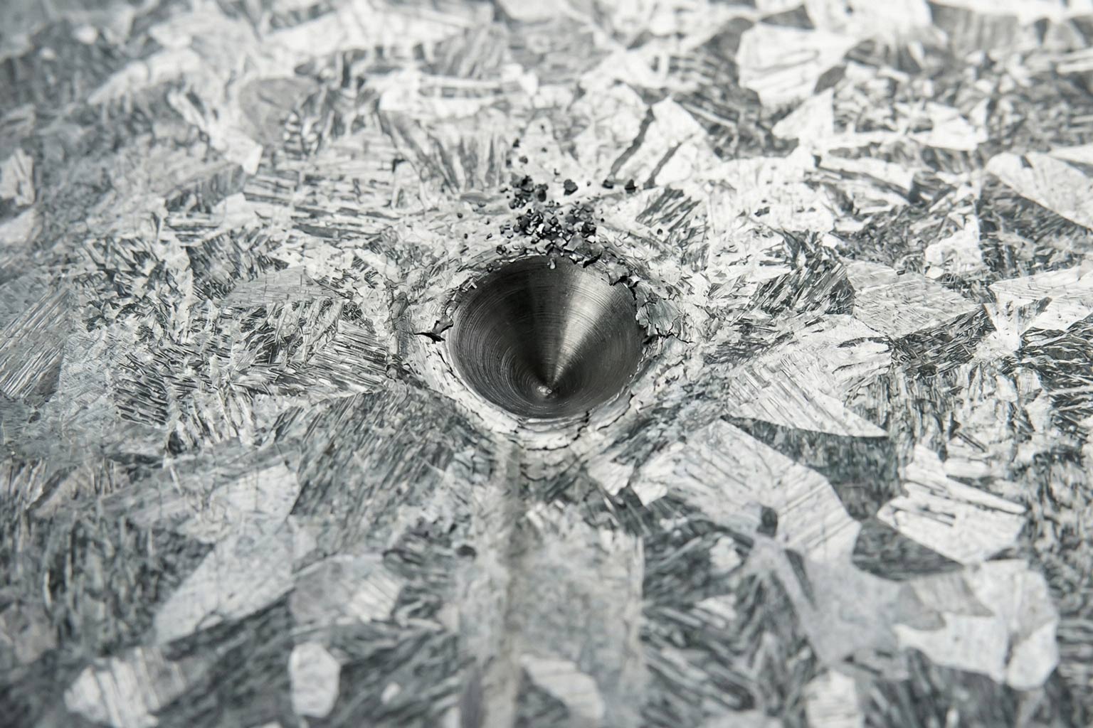 Hot dip galvanized steel surface under mechanical contact conditions in industrial setting