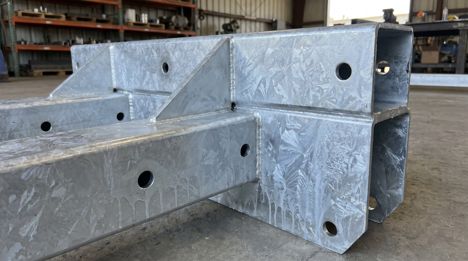 Fabricated steel assembly designed with proper venting and drainage for hot dip galvanizing