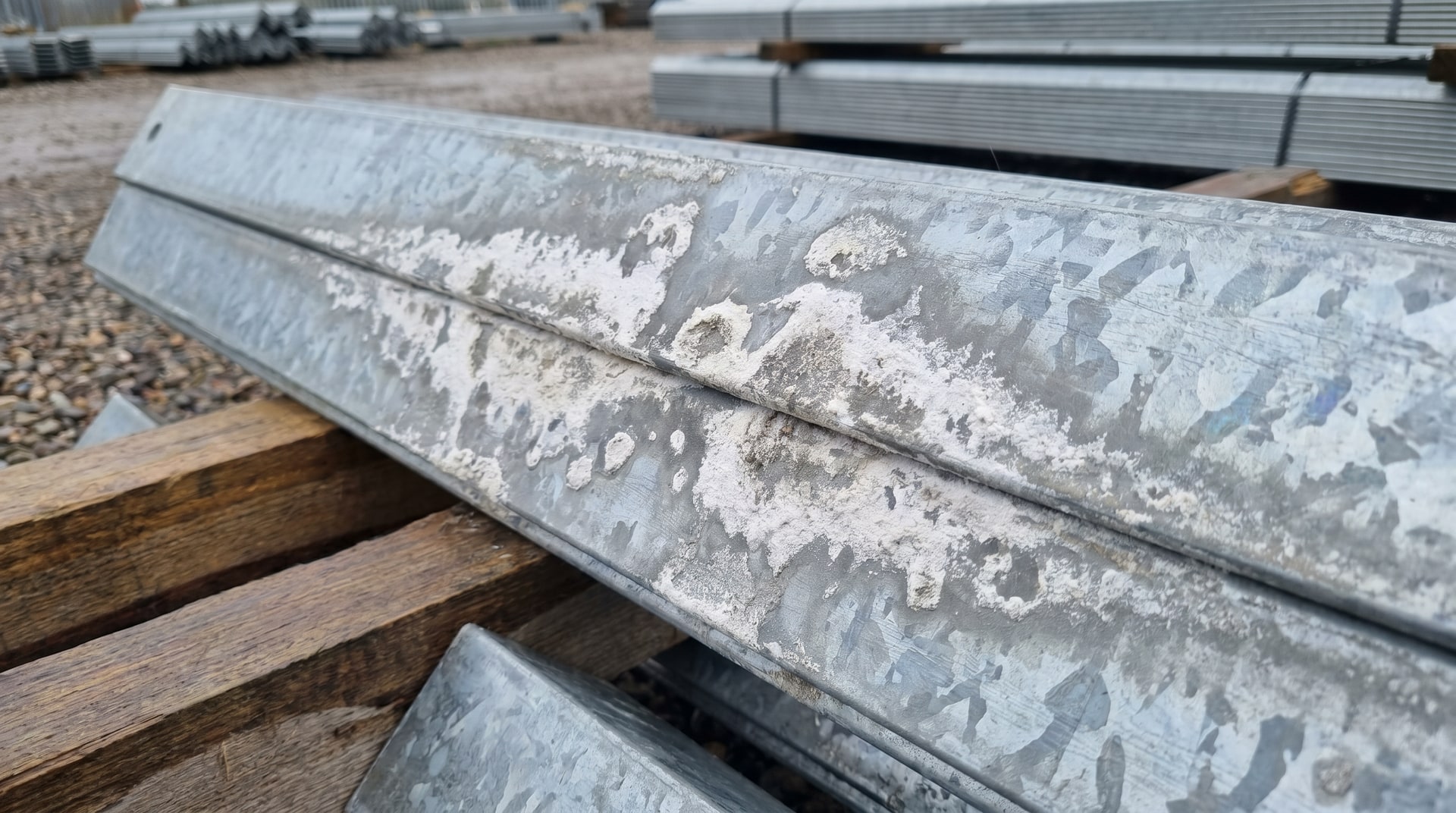 Galvanized steel with visible white rust from prolonged moisture exposure