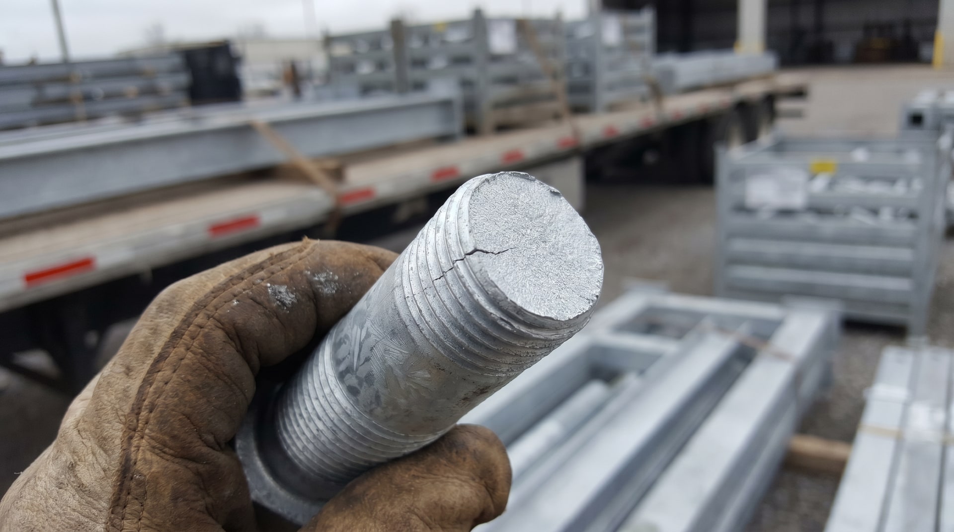 Galvanized steel component under stress illustrating potential embrittlement behavior