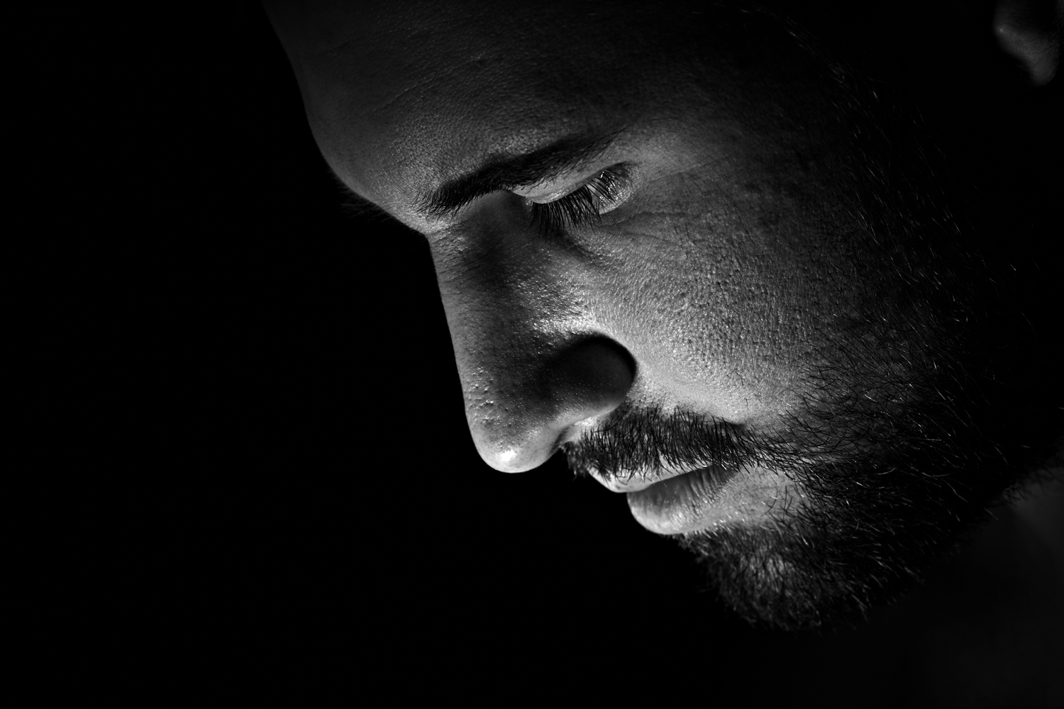 Close-up portrait of a person looking down