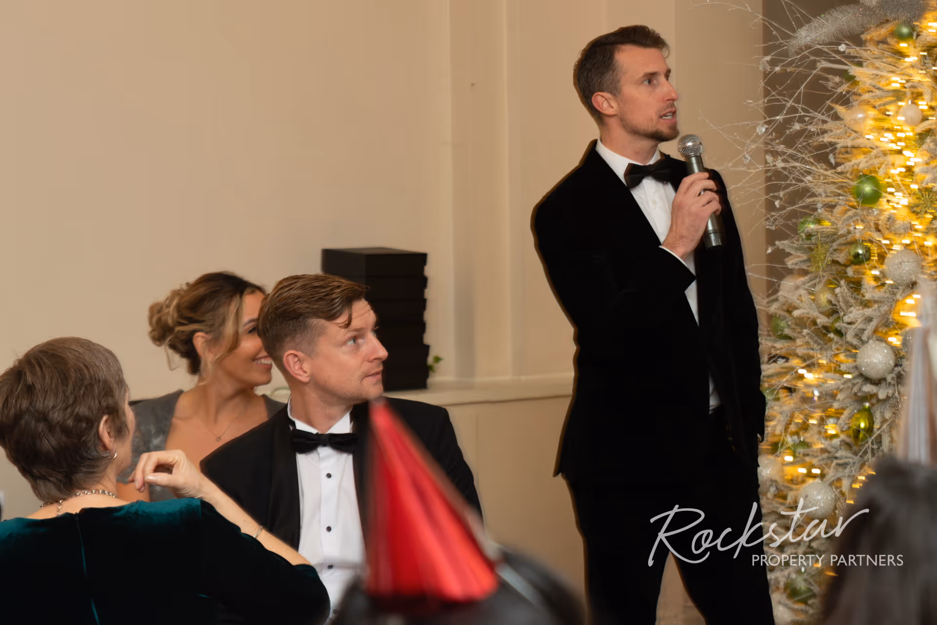 Kane Andrews speaking at an event