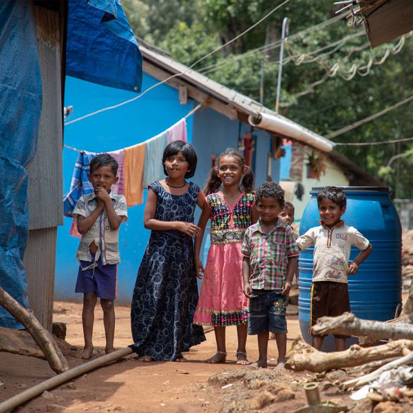 Children gathered outside in the sun