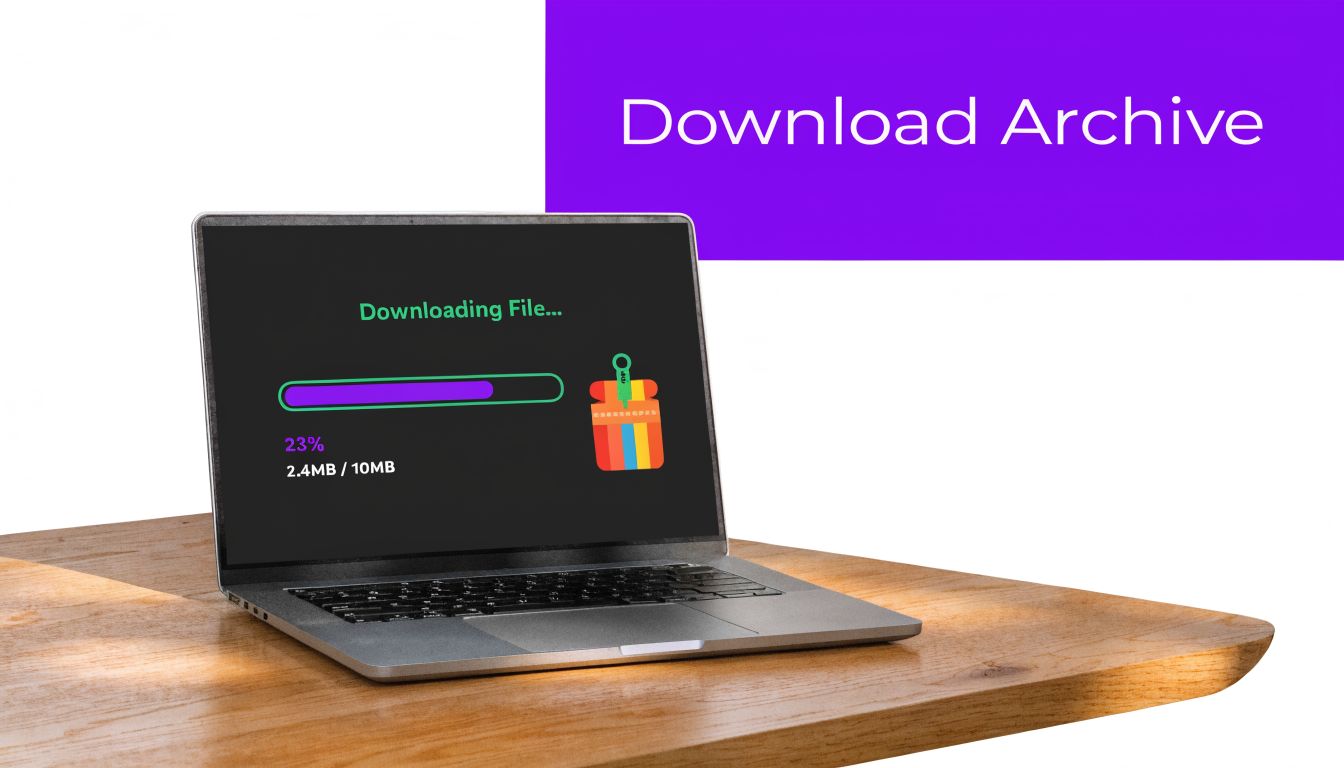 A silver laptop showing a file download process on the screen sits on a wooden desk.