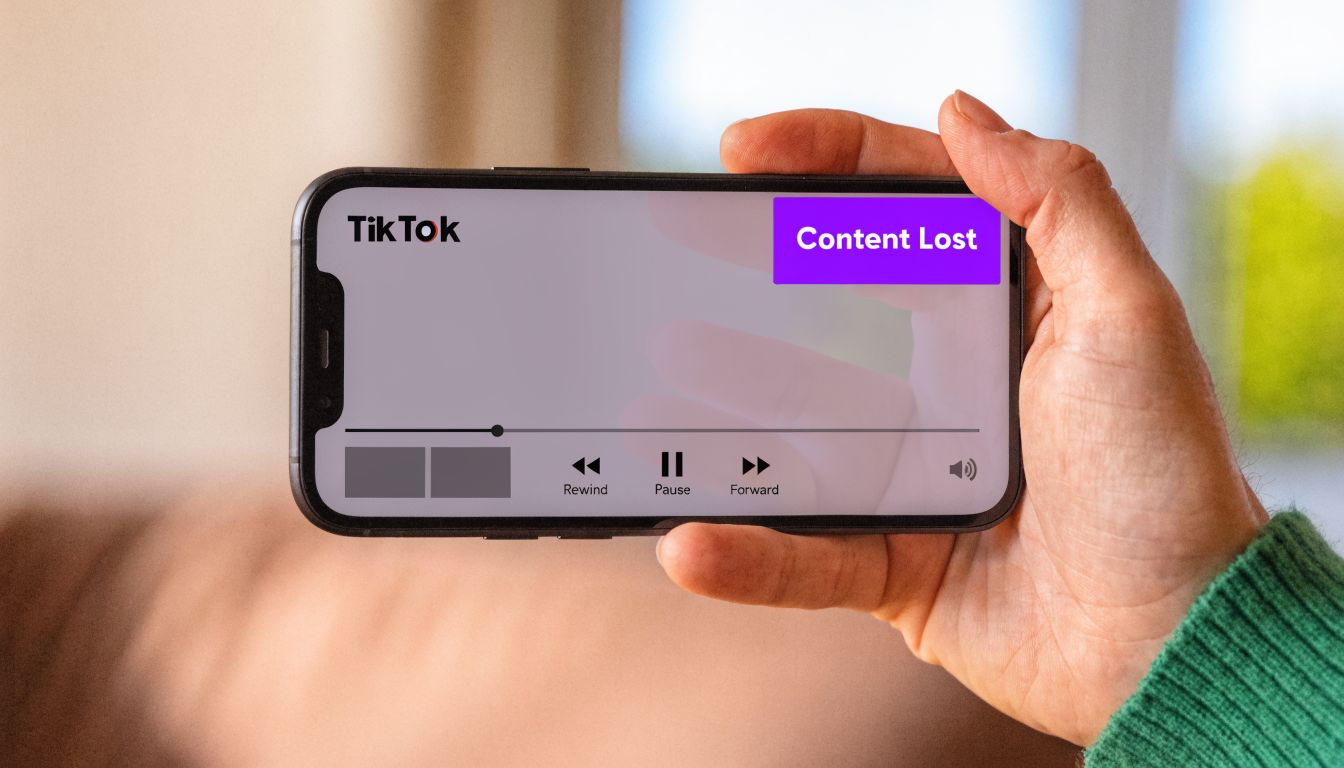 A hand holding a smartphone displaying a TikTok video interface with a Content Lost error message overlay.