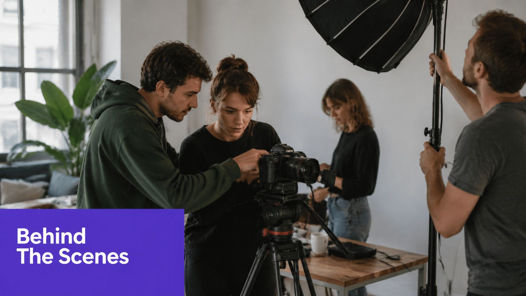 A professional video production crew working together on a set behind the scenes of a shoot.