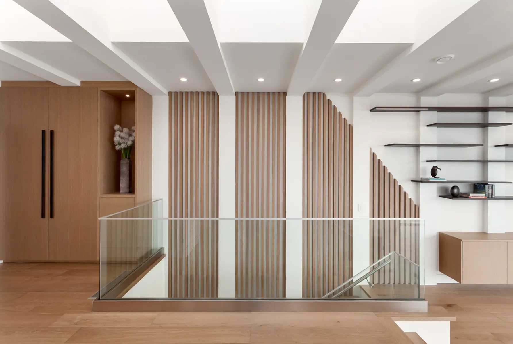 Slatted oak stair screen and glass railing beneath a beamed skylight, Folkstone Way rebuild