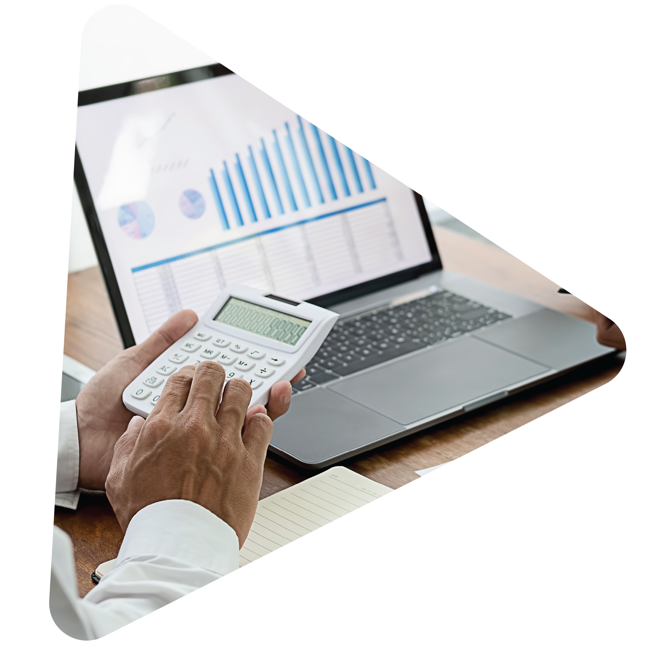 Business man using a calculator with financial graphs in the background