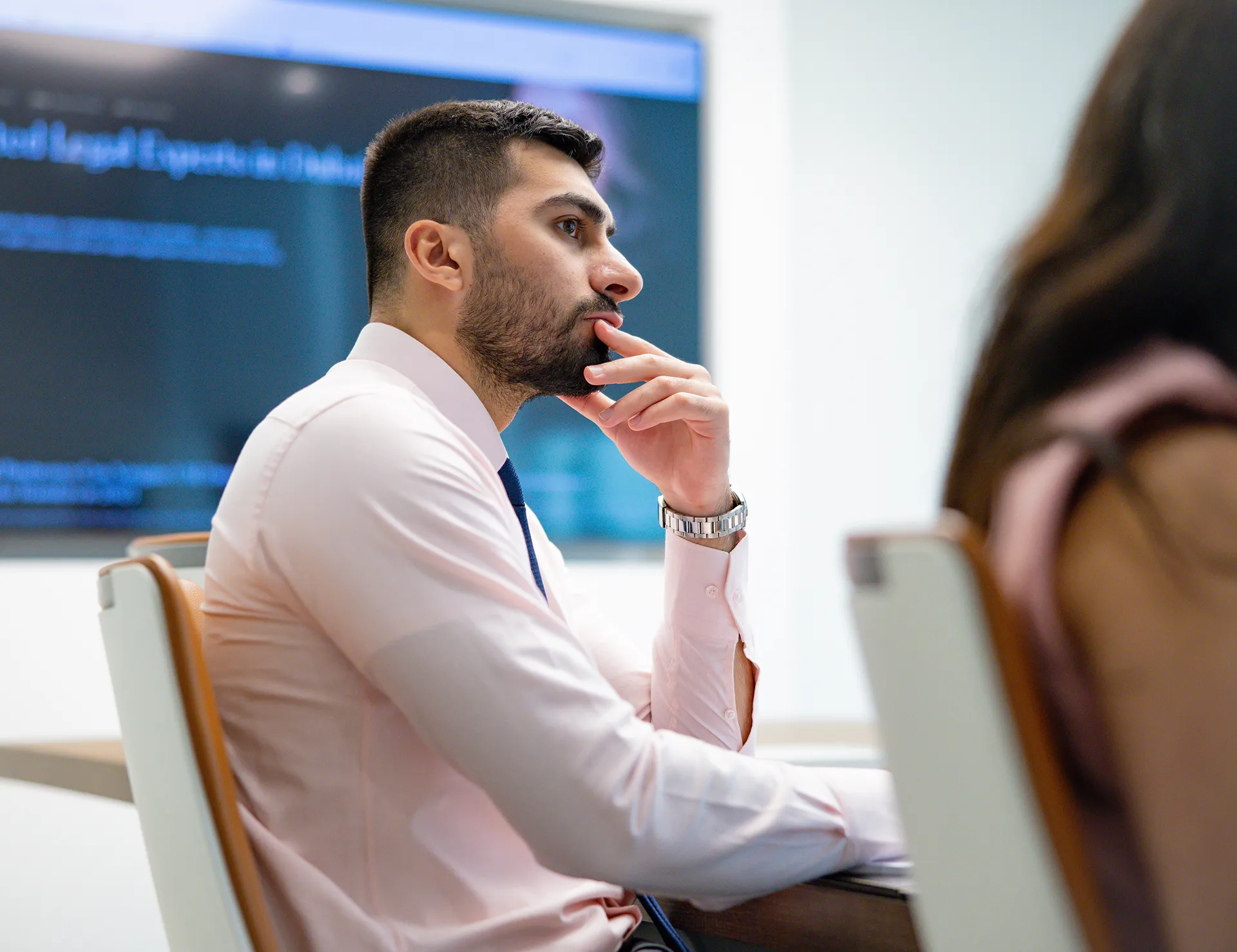 Muhammed Ali Charif, litigator at Kayrouz & Associates, in discussion during a legal strategy meeting.