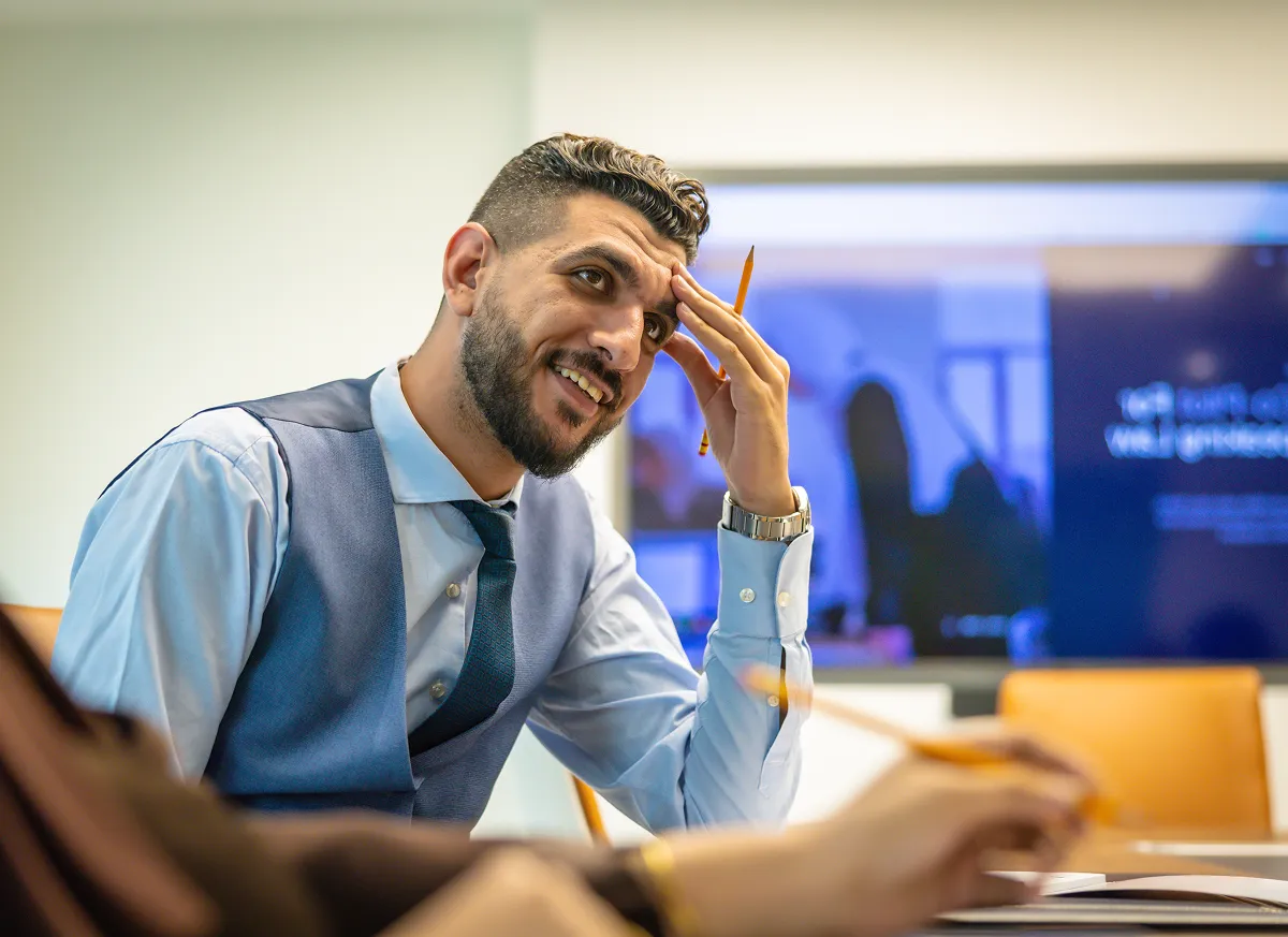 Saeed Gaber, Legal Research Analyst, in a client meeting discussing case strategy at Kayrouz & Associates office