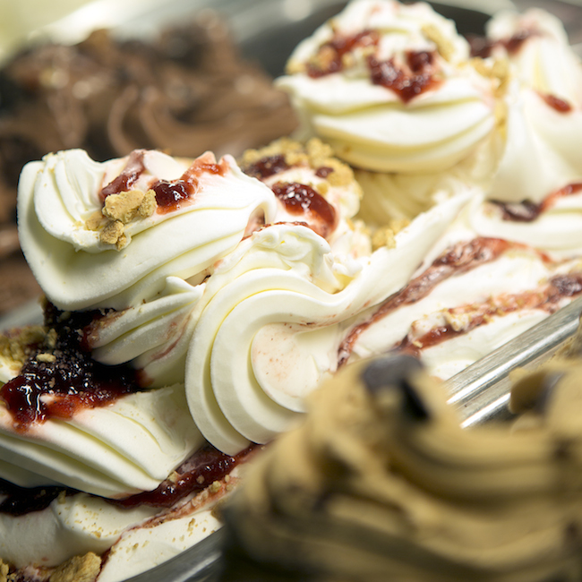 close up of gelato in metal pan containers