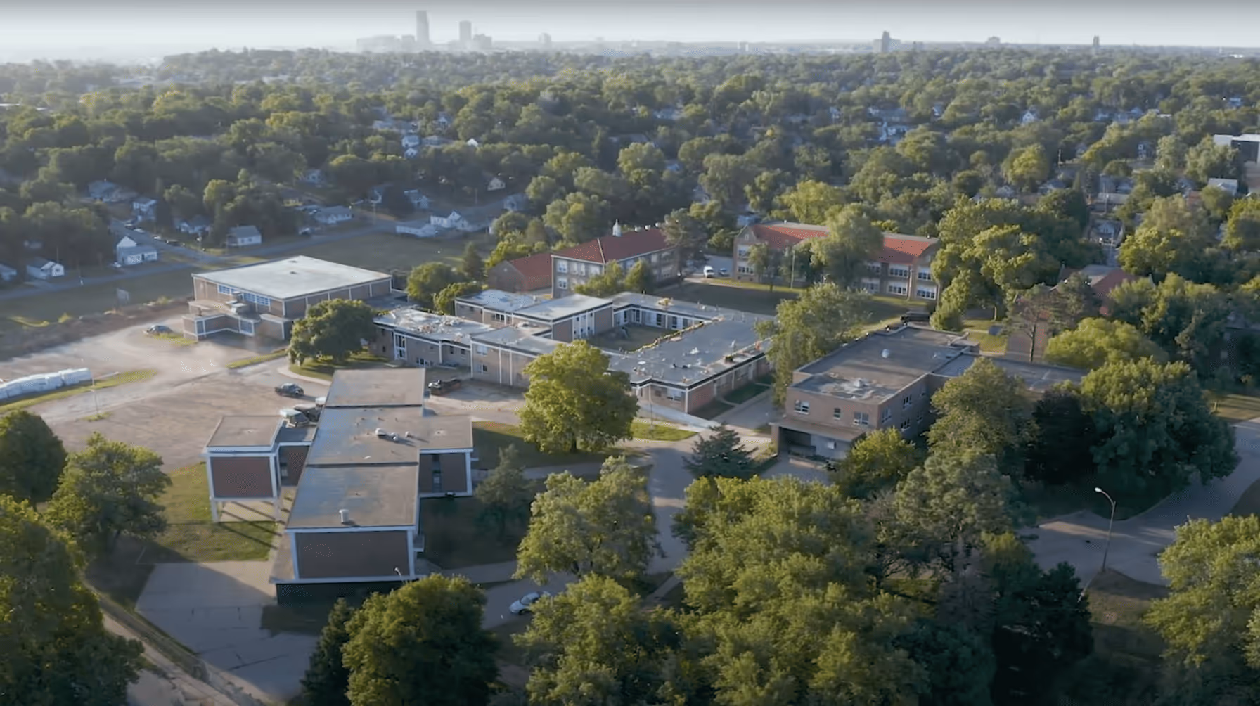 An aerial view of a city with lots of trees.