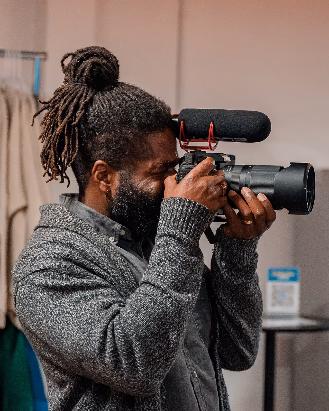A man taking a picture with a camera.