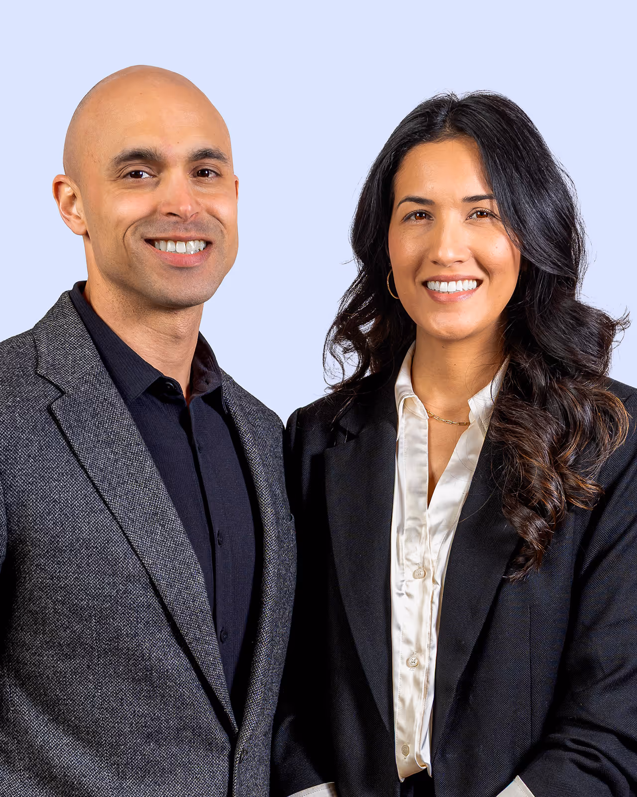 A man and a woman standing next to each other.