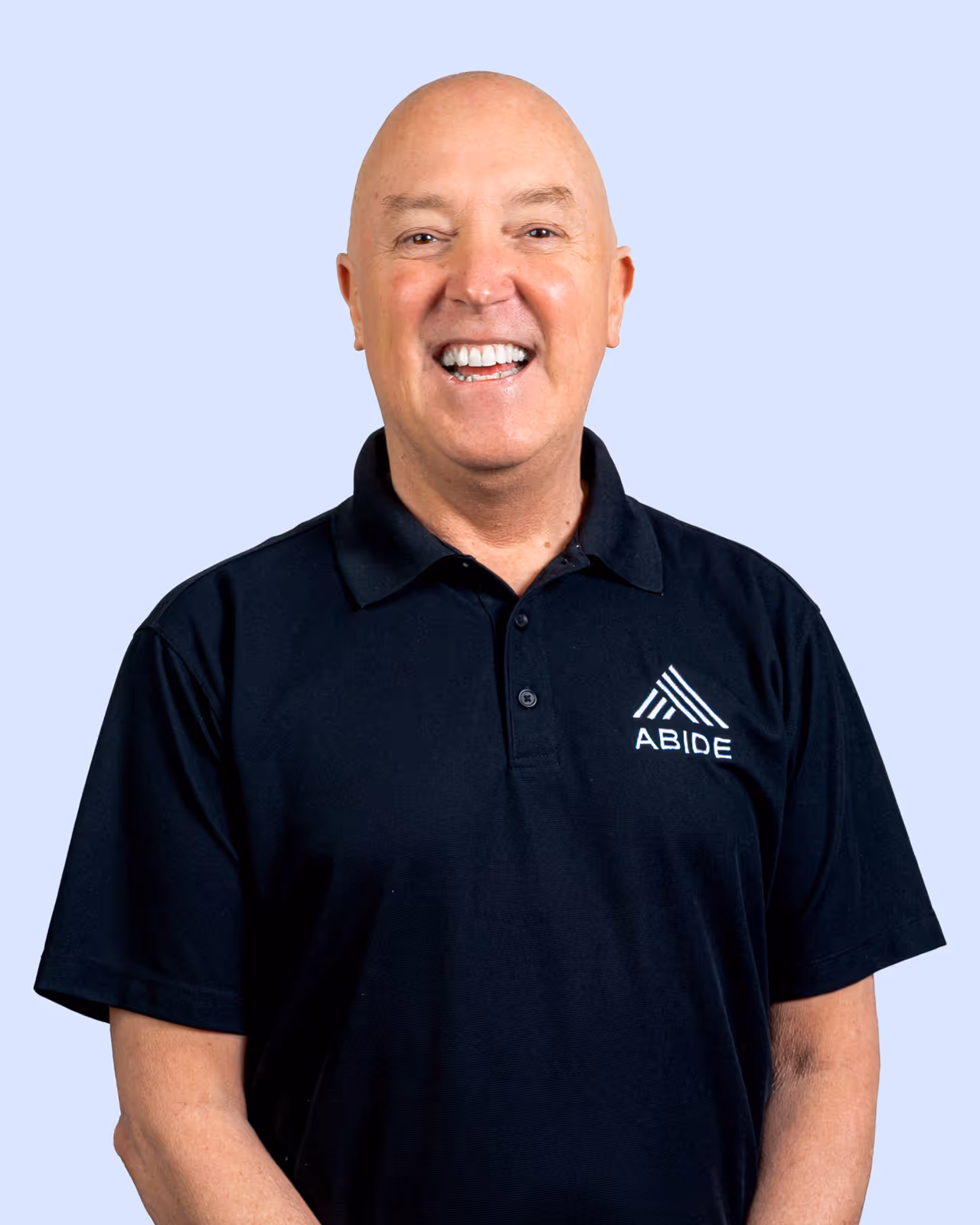 A man with a bald head wearing a black shirt.