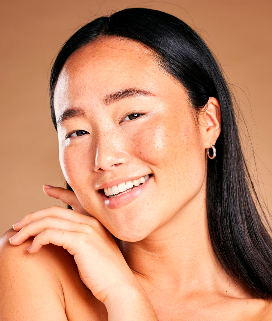 Smiling asian woman with beautiful skin