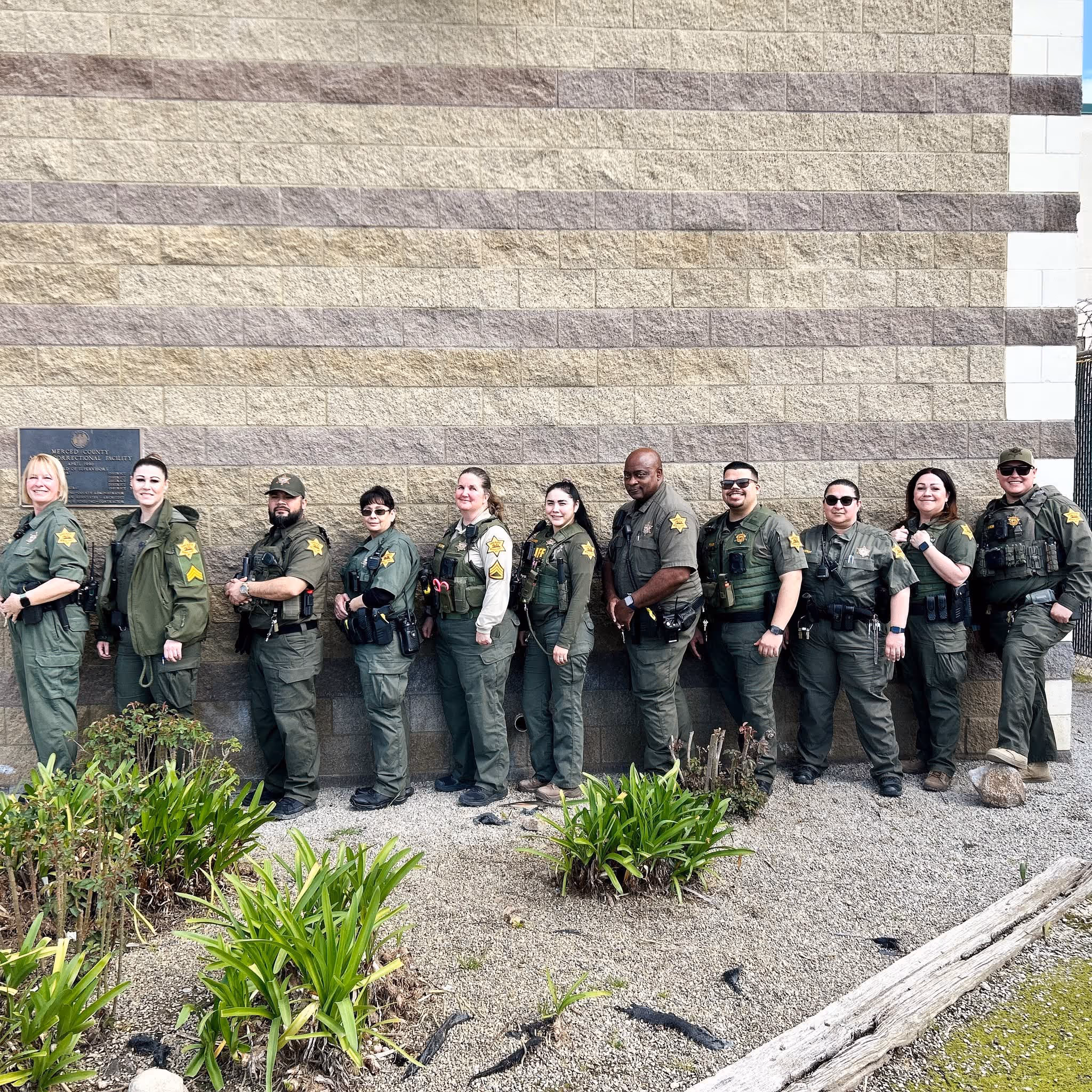 Group photo of Merced County SCA Deputies outside a government building