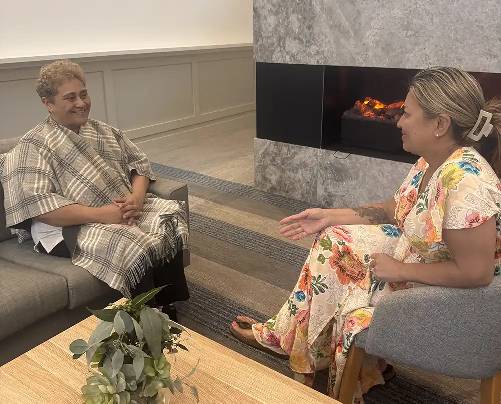 Miriama with a client in session discussing life