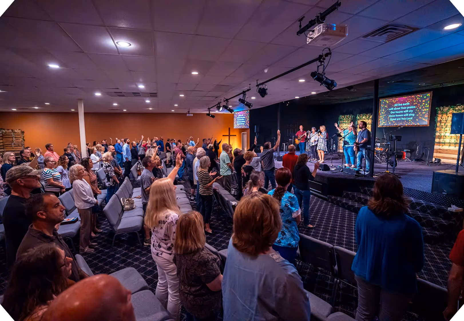a group of people in a worship service