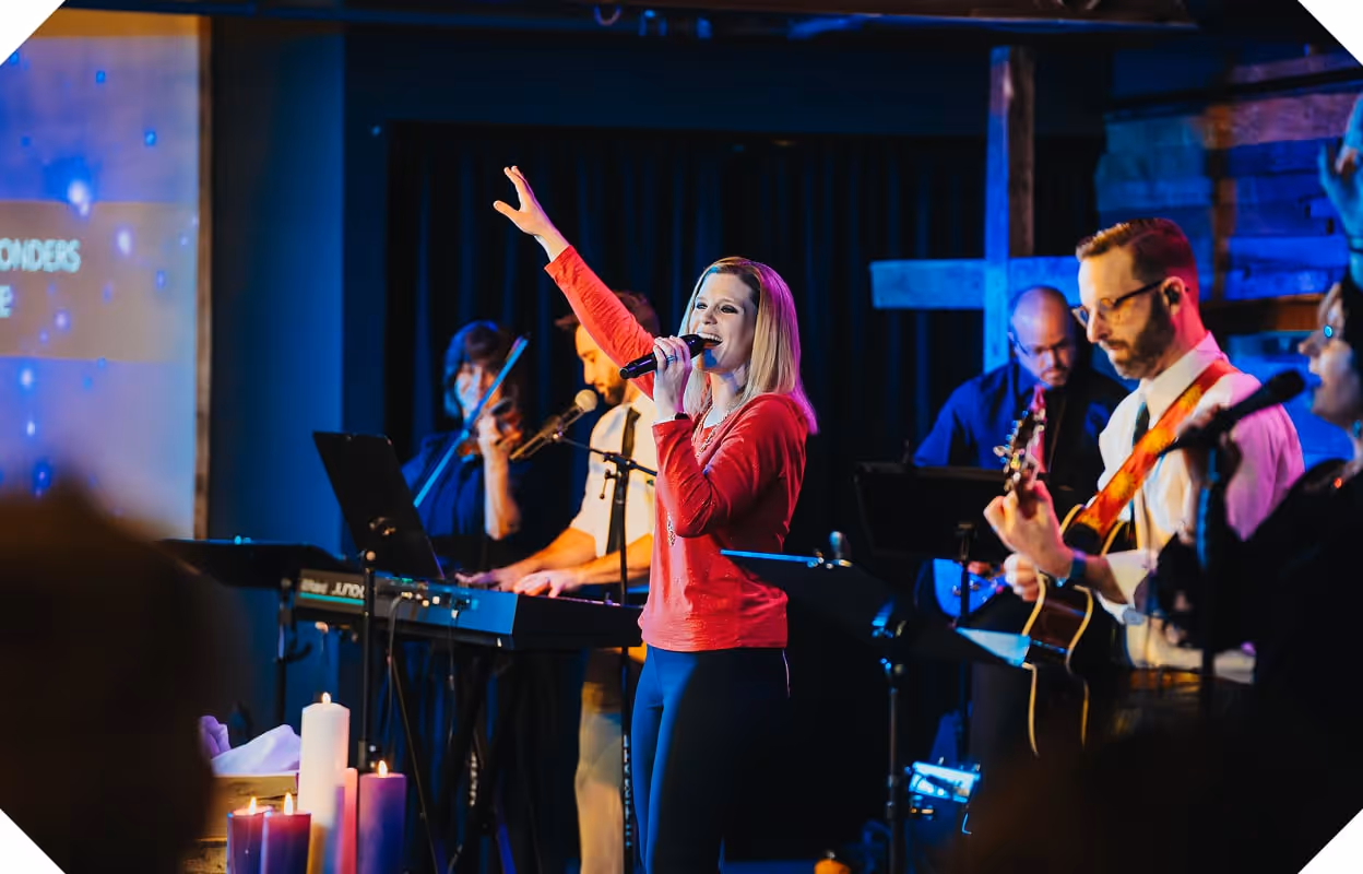 A group shot of a singer and band