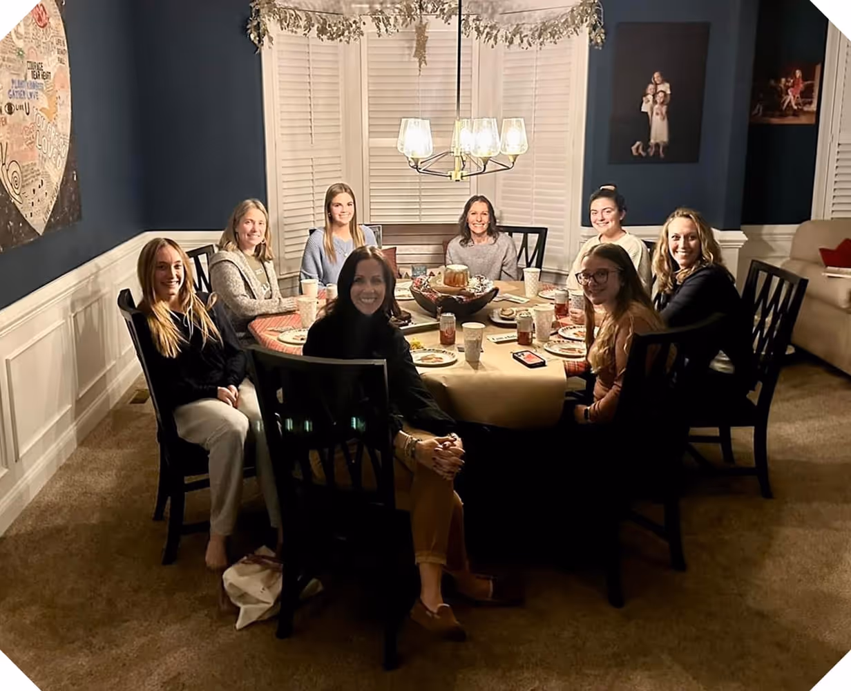 a group of women sitting around a table
