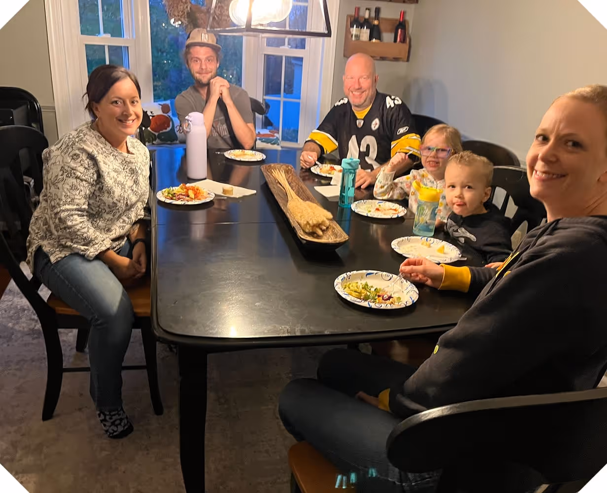 a group of people sitting at a table