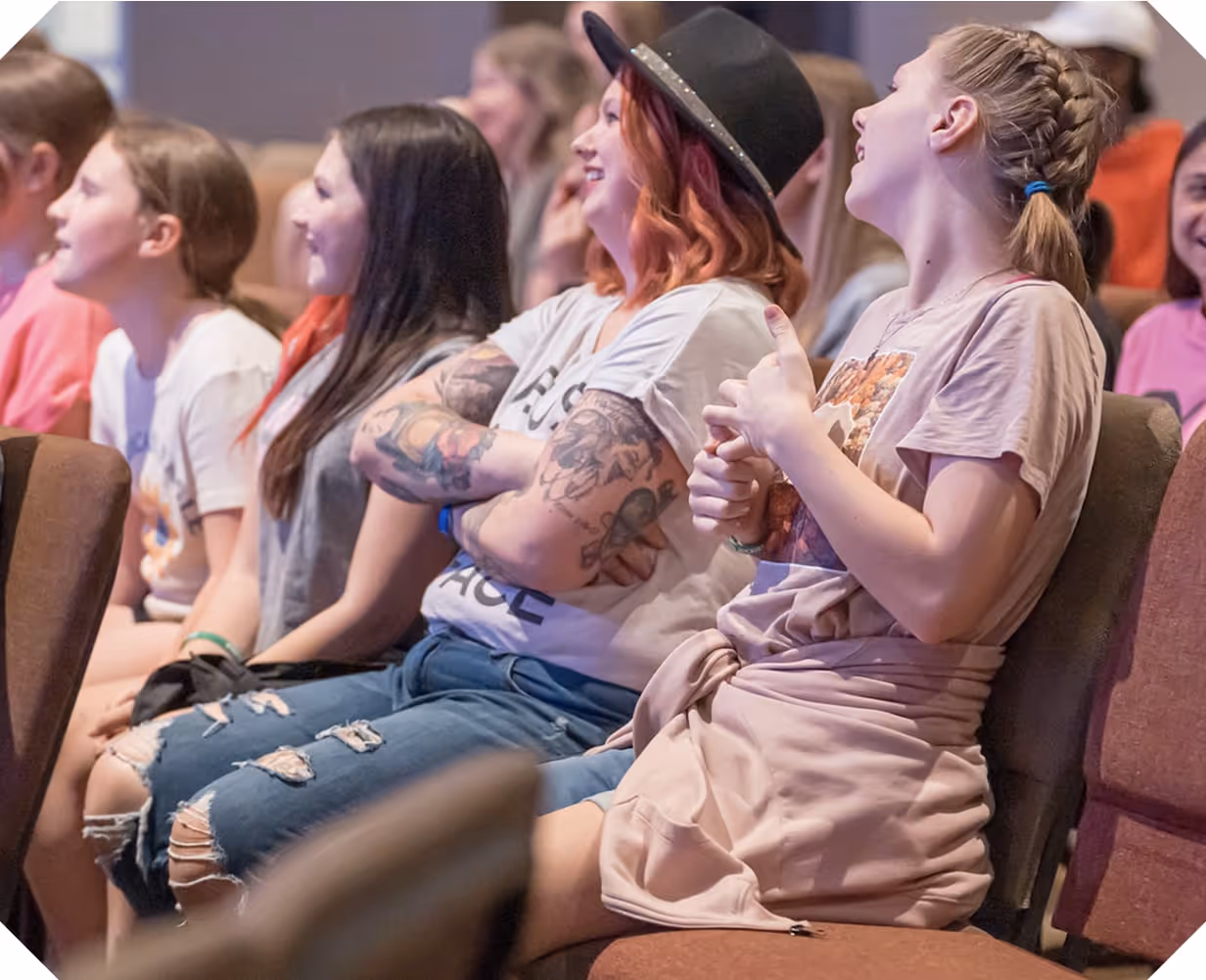 A group of teenage girls laughing together